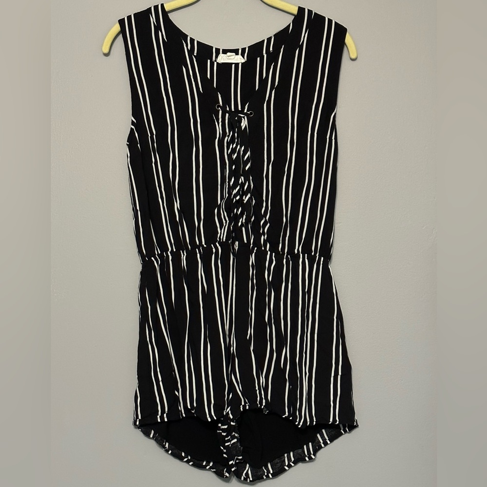 Black and white vertical striped sleeveless romper
